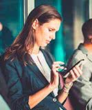 Woman using cell phone in public.